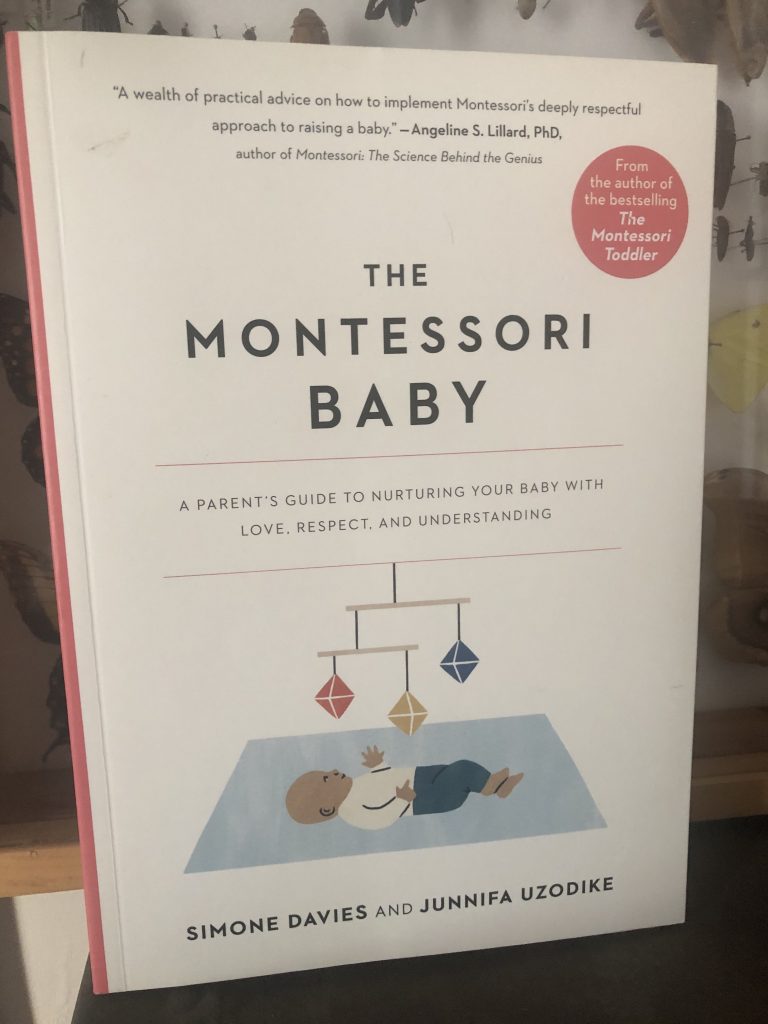 The Montessori Baby book cover, white, with baby under octohedron mobile with the subheading A Parent's guide to nurturing your baby with love, respect, and understanding